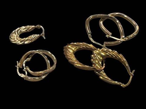 Three pairs of 9 carat gold earrings.