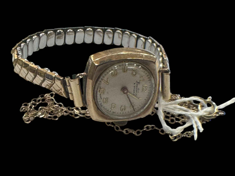 Ladies 9 carat gold watch and two chain remnants.
