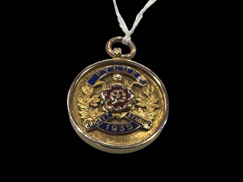 9 carat gold 1935 cricket league medal.