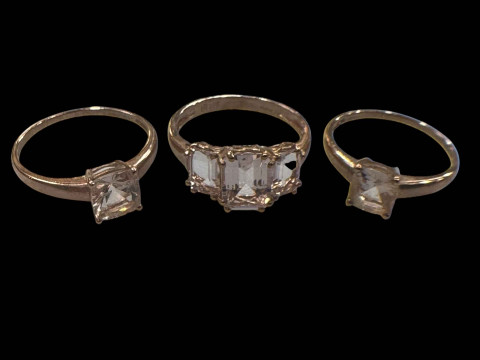 Three 9 carat gold gem set rings.