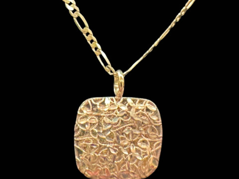 9 carat gold pierced pendant and chain.