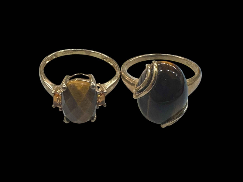 Two 9 carat gold tigers eye set rings.