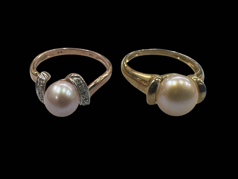 Two 9 carat gold gem set rings.