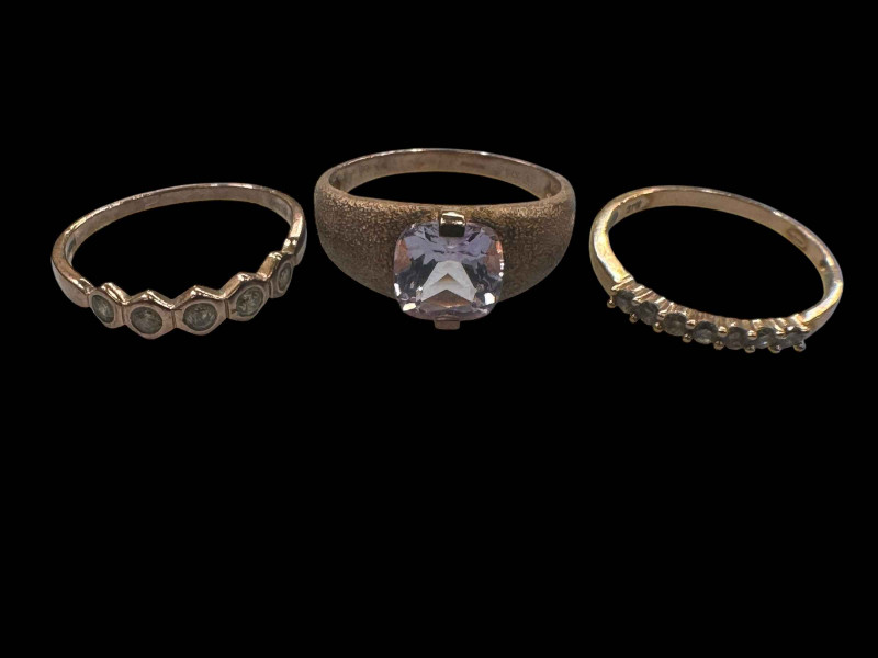Three 9 carat gold gem set rings.