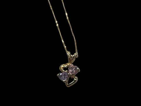9k gold chain and gem set pendant.
