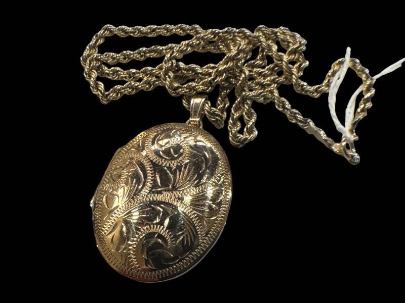 9 carat gold engraved locket with rope twist chain.