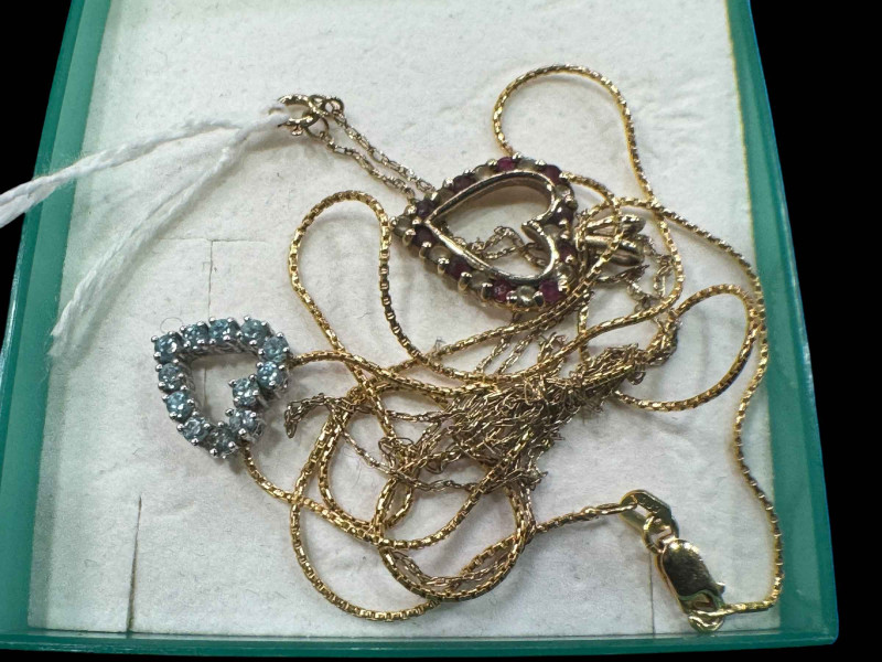 14 carat and 9 carat gold chains with heart pendants.
