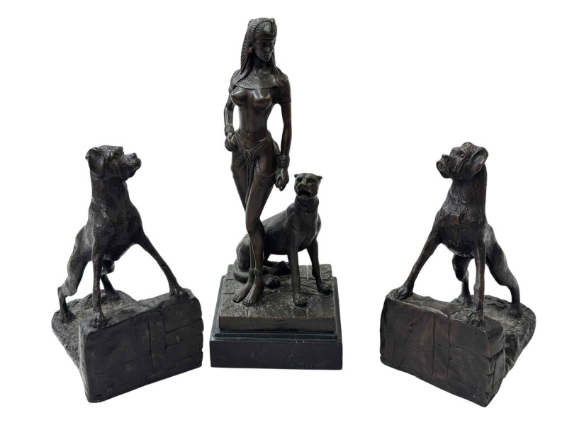 Pair of bronze Boxer Dog bookends and a bronze figural lady with wild cat on marble plinth.