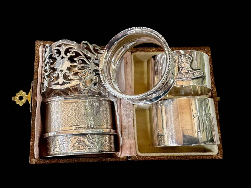 Collection of six silver napkin rings including pierced and engine-turned.