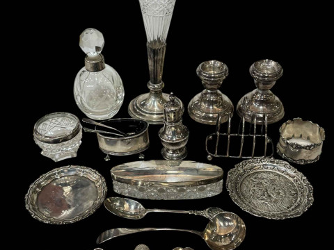 Collection of silver pieces including dwarf candlesticks, cruets, caddy...
