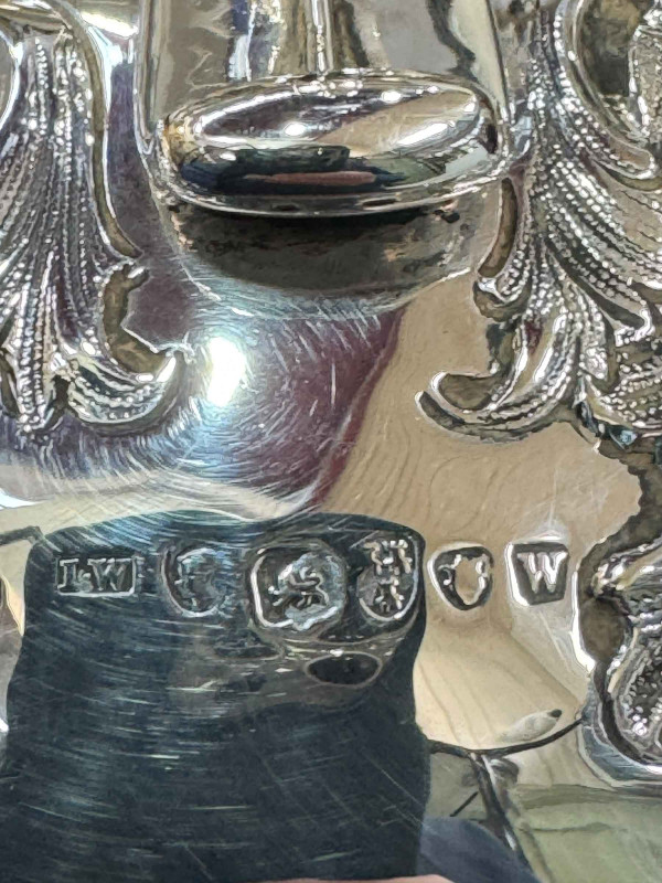 William IV silver four piece tea and coffee set having embossed decoration and on scroll feet, John Walton, Newcastle, 1835.