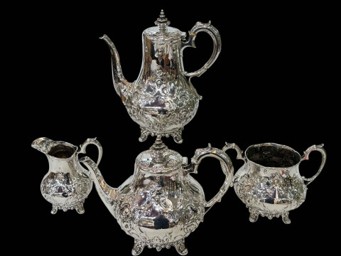 William IV silver four piece tea and coffee set having embossed decoration and on scroll feet, John Walton, Newcastle, 1835. thumbnail