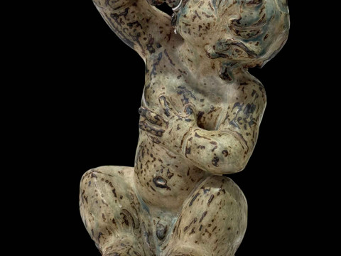 Large Knud Kyhn Royal Copenhagen sitting faun, 33cm.