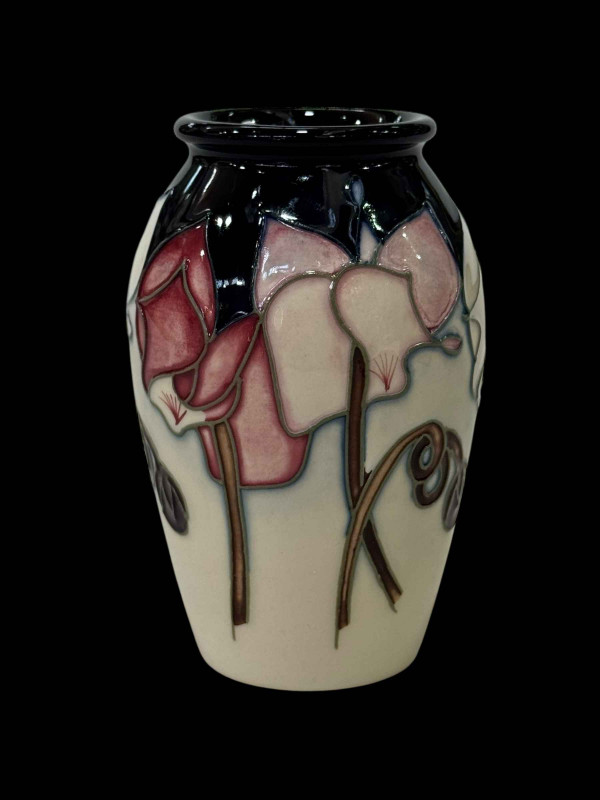 Boxed Moorcroft vase.