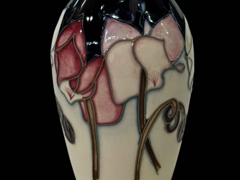 Boxed Moorcroft vase.