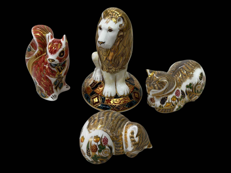 Four Royal Crown Derby paperweights including Heraldic Lion, Squirrel, Cat and Kitten.