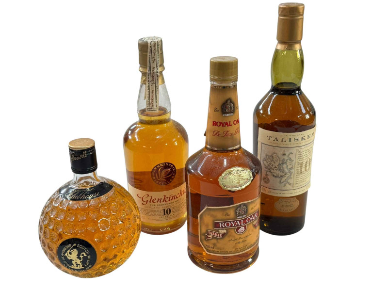 Four bottles of Whisky, Talisker, St. Andrews Clubhouse, Royal Oak Deluxe Rum and Glenkinchie 10 Years Old.