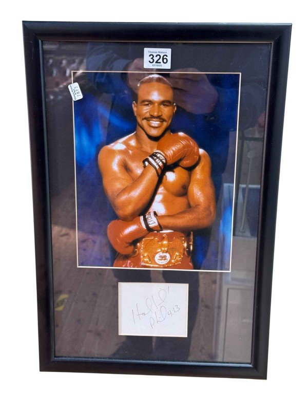 Evander Holyfield, framed autograph and photographic print, with COA, 45cm by 30.5cm, including frame.
