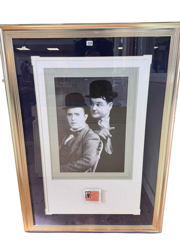 Laurel & Hardy signed presentation with a framed photographic reprint, 132.5cm by 93.5cm including frame, COA verso.