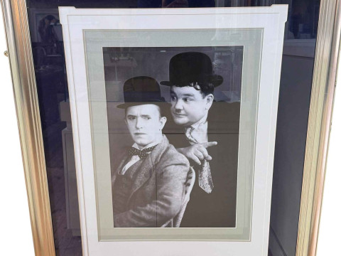 Laurel & Hardy signed presentation with a framed photographic reprint,...