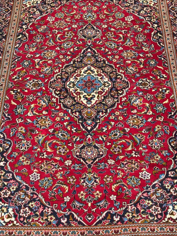 Persian floral decorated carpet with central medallion, 3.30 by 2.40.