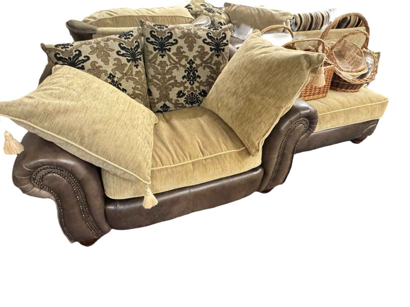 Brown studded leather and fabric five piece lounge suite comprising two seater settee, two chairs, large chair and footstool (some of the legs are not affixed and need attention).