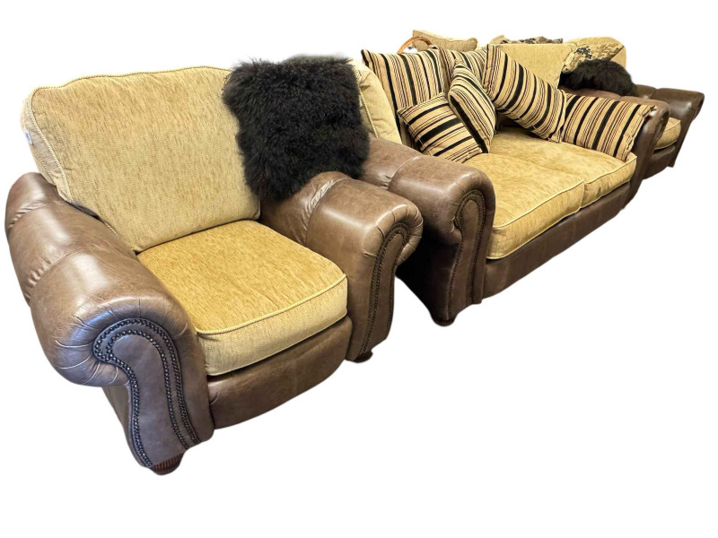 Brown studded leather and fabric five piece lounge suite comprising two seater settee, two chairs, large chair and footstool (some of the legs are not affixed and need attention).
