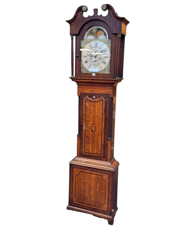 Antique oak and mahogany month going five pillar movement longcase clock having brass and silvered arched moon phase dial, 230cm.