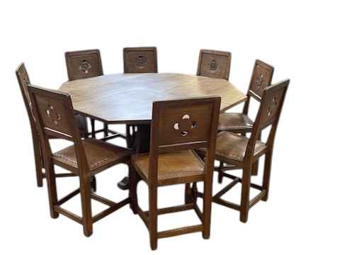 Albert 'Eagleman' Jeffray octagonal adzed oak dining table, 74cm by 144cm, and set of eight Yorkshire Rose panel back dining chairs. thumbnail