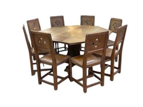 Albert 'Eagleman' Jeffray octagonal adzed oak dining table, 74cm by 144cm, and set of eight Yorkshire Rose panel back dining chairs. thumbnail