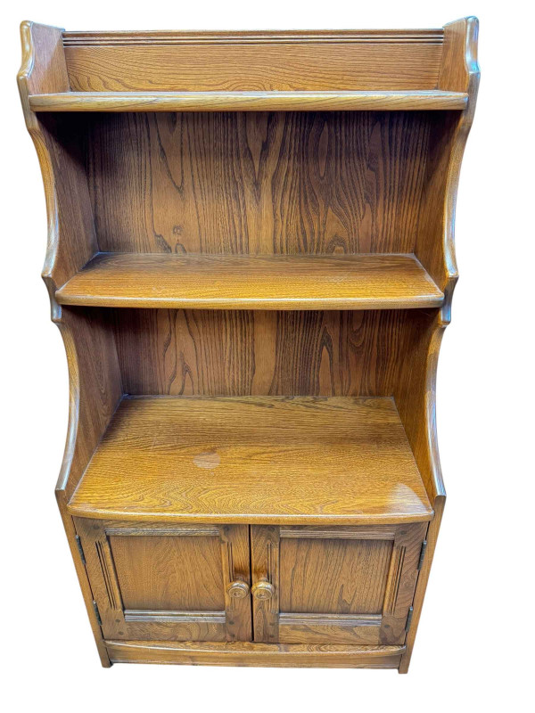 Ercol Old Colonial waterfall cabinet bookcase, 110.5cm by 61cm by 34cm.