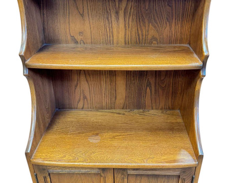 Ercol Old Colonial waterfall cabinet bookcase, 110.5cm by 61cm by 34cm.