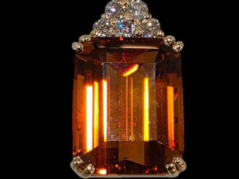 Golden citrine emerald cut and diamond pendant set in 18 carat white gold.