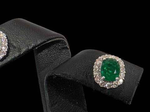 Pair of emerald and diamond cluster earrings, claw set in white gold,...
