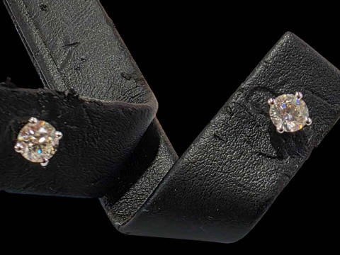 Pair of 18 carat white gold and diamond stud earrings.