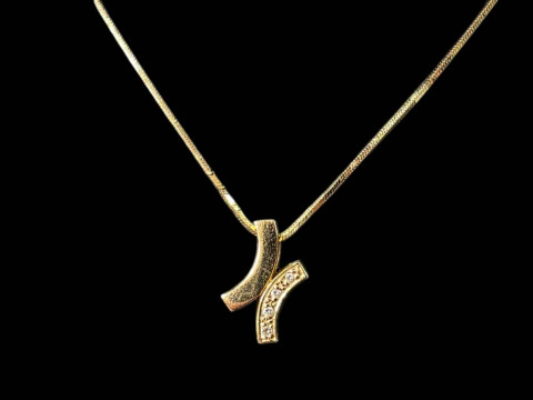 18 carat gold necklace and gold tiny diamond set pendant.