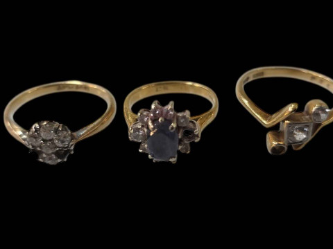 Three 18 carat gold gem set rings (stones missing).