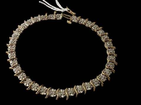 9 carat gold and diamond illusion set bracelet.