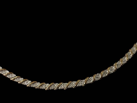 9 carat two colour diamond set bracelet.