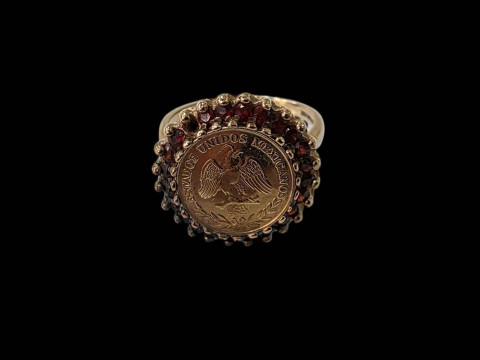 9 carat gold ring set with 1945 Mexican coin and gem set border, size...