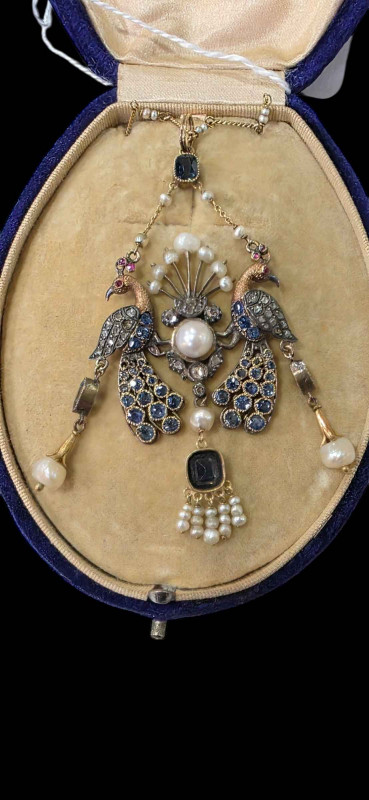 1920's sapphire and pearl set peacock pendant with chain, cased.