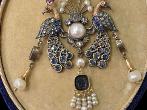 1920's sapphire and pearl set peacock pendant with chain, cased.