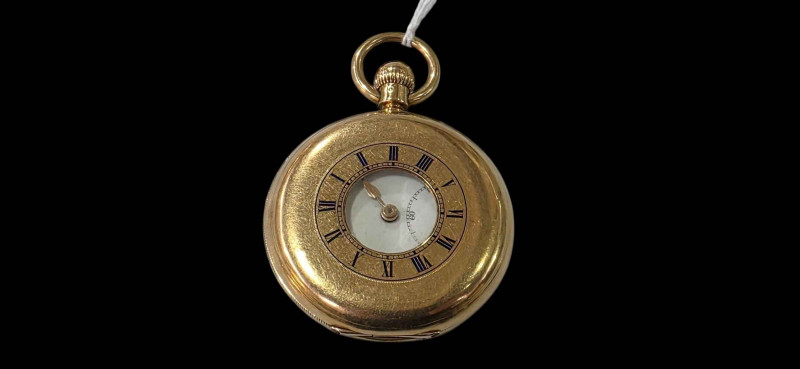 18 carat gold gents half hunter keyless pocket watch.
