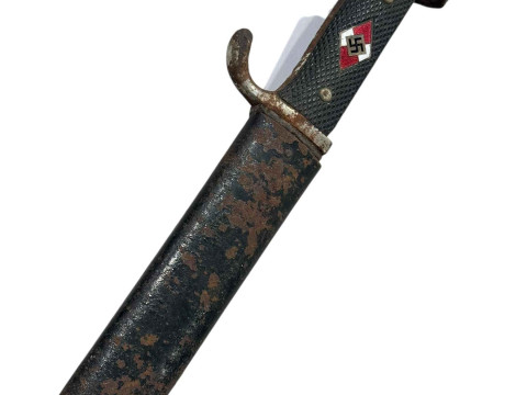 A 1933 Hitler Youth dagger and sheath, 13cm blade, the name is rusted...