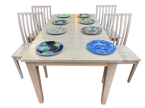 Treske rectangular table with leaf and four rail back dining chairs in...