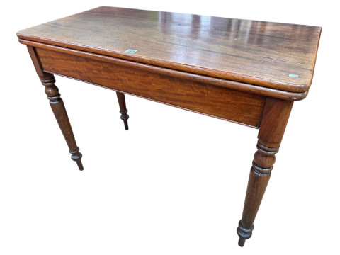 Late Victorian mahogany turn over top tea table on turned legs.