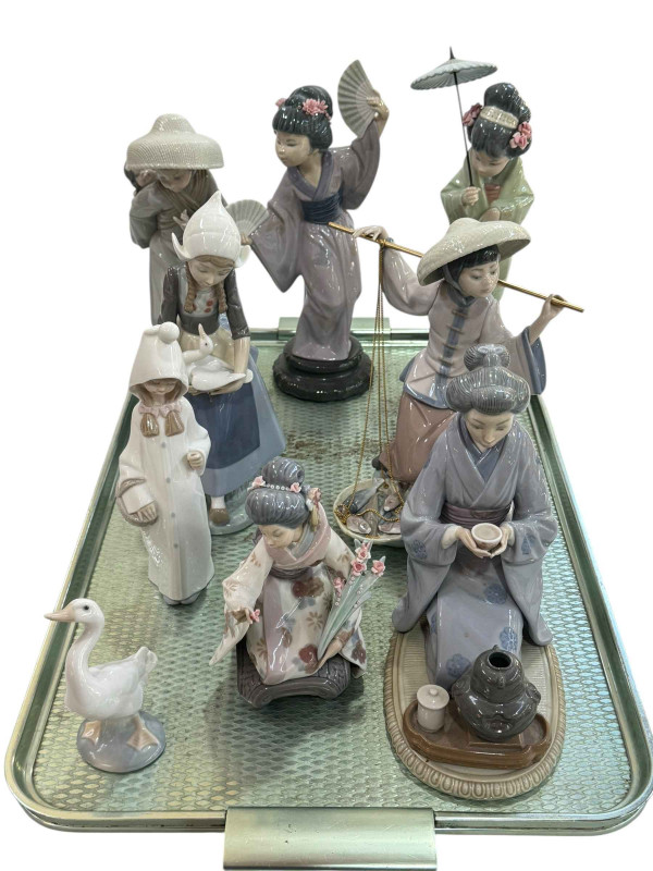 Collection of Lladro figurines including Geisha Girls, Japanese ladies, ducks, etc.