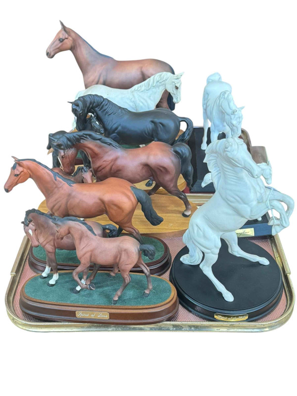 Collection of Royal Doulton and Beswick horse figures including Arkle, Black Beauty and Foal, etc.