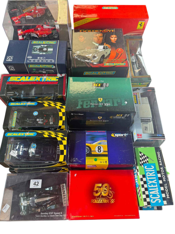 Collection of diecast Scalextric vehicles including James Bond Goldeneye, limited edition Ferrari 330/P4 Monza 1967, etc.