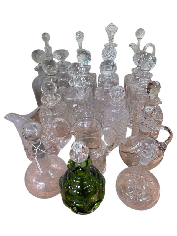 Collection of glass decanters, claret jug, green glass, etc.